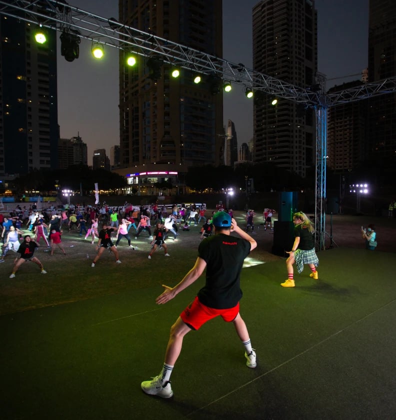Employees at an outdoor group exercise event